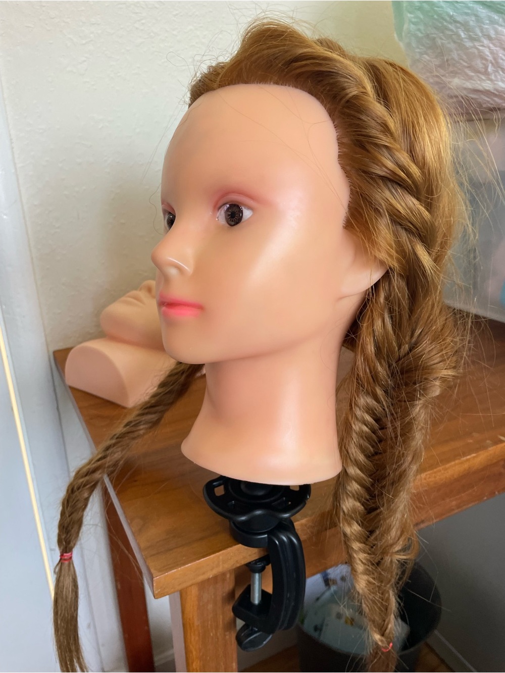 Training Mannequin Head with Brown Hair for Styling Practice
With table crammed